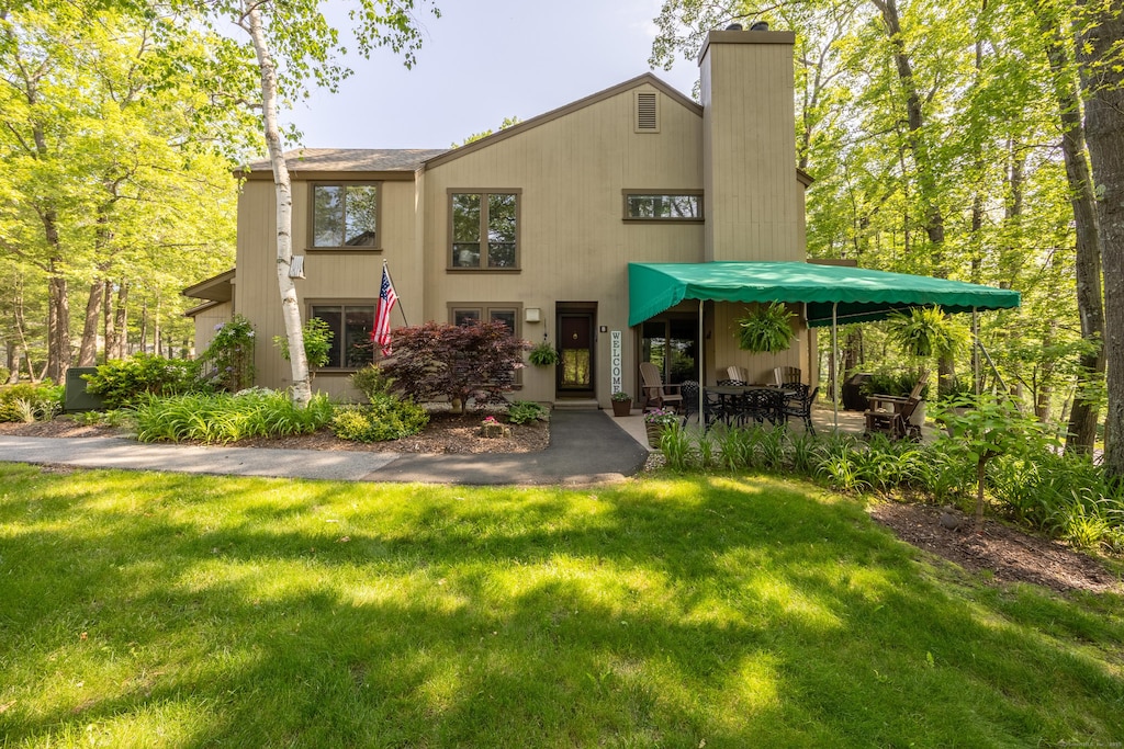 8 Cottonwood Dr Unit 8, Avon, CT 06001 - view of front of property featuring a front yard and a chimney