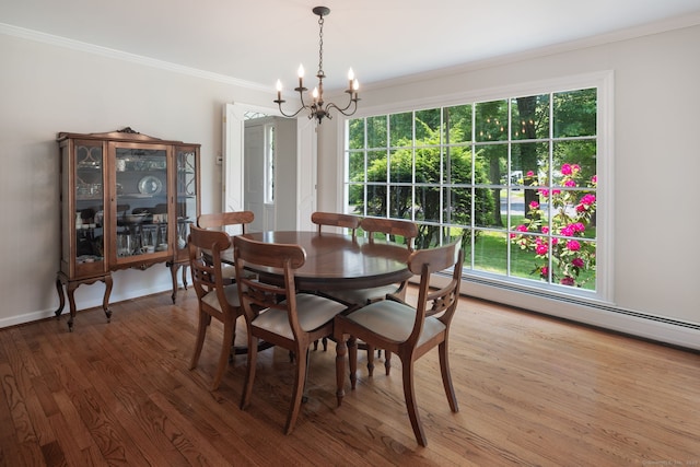 43 Hall Rd, Easton, CT 06612 - dining room with a chandelier, crown molding, wood finished floors, healthy amount of natural light, and a baseboard radiator