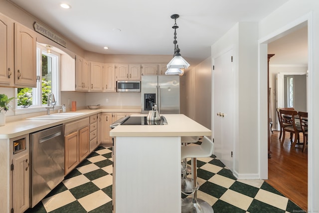 43 Hall Rd, Easton, CT 06612 - kitchen featuring appliances with stainless steel finishes, light flooring, a center island, a breakfast bar, and light countertops