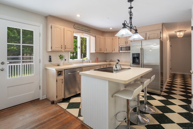 43 Hall Rd, Easton, CT 06612 - kitchen featuring appliances with stainless steel finishes, light floors, light countertops, a breakfast bar, and recessed lighting