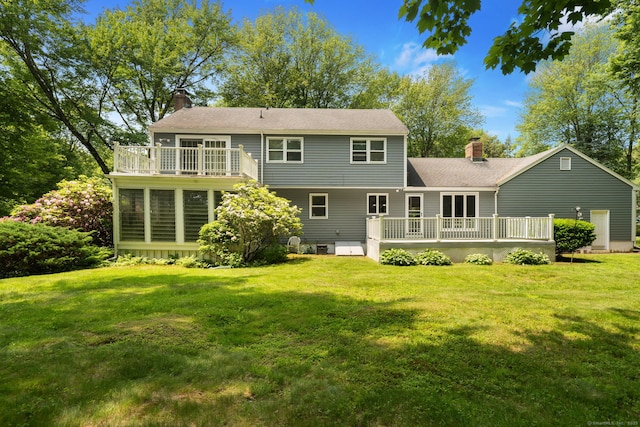 43 Hall Rd, Easton, CT 06612 - rear view of property with a chimney, a wooden deck, a lawn, and a shingled roof
