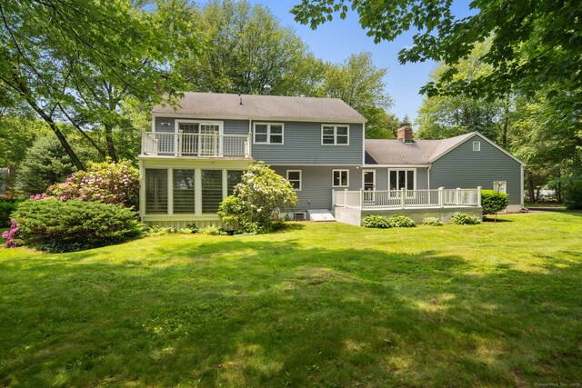 43 Hall Rd, Easton, CT 06612 - back of house with a deck, a lawn, a chimney, and a shingled roof