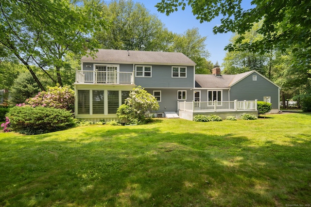 43 Hall Rd, Easton, CT 06612 - rear view of property featuring a deck, a yard, a chimney, and roof with shingles