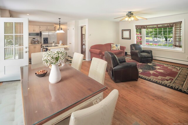 43 Hall Rd, Easton, CT 06612 - dining area with a baseboard heating unit, light wood-style floors, a ceiling fan, and recessed lighting