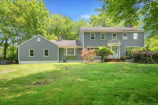 43 Hall Rd, Easton, CT 06612 - view of front of house featuring a chimney, a front lawn, and a shingled roof