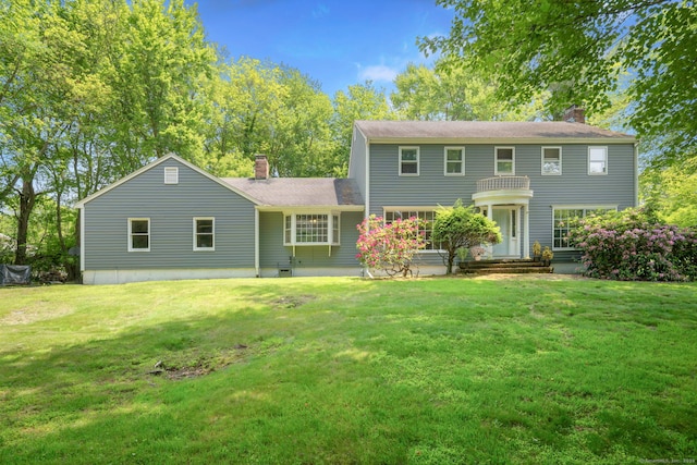 43 Hall Rd, Easton, CT 06612 - view of front of house with a chimney, a front lawn, and a shingled roof