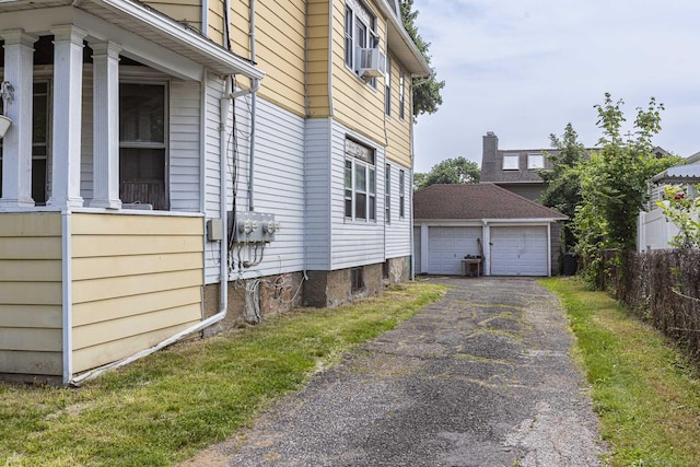 3800 Main St, Stratford, CT 06614 - view of side of property featuring a garage and an outdoor structure