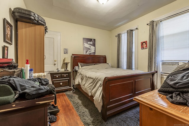 3800 Main St, Stratford, CT 06614 - bedroom with dark wood-type flooring and cooling unit