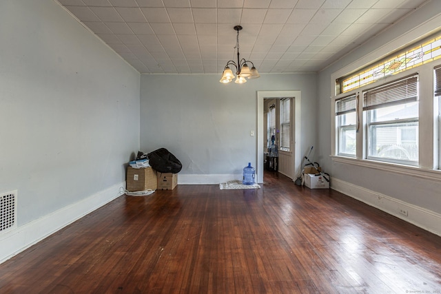 3800 Main St, Stratford, CT 06614 - unfurnished dining area featuring a chandelier, hardwood / wood-style flooring, and baseboards