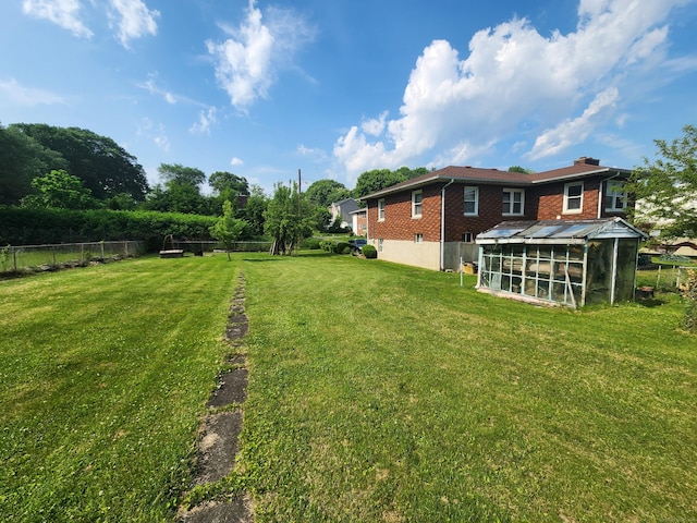 82 Hotchkiss St, Waterbury, CT 06704 - view of yard featuring a sunroom