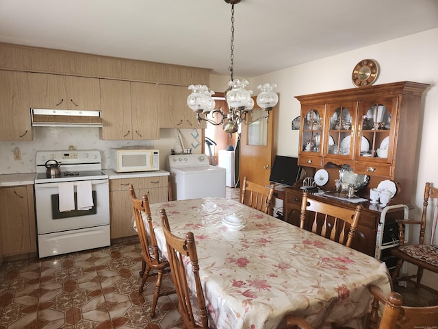 82 Hotchkiss St, Waterbury, CT 06704 - dining area featuring washer / clothes dryer and a chandelier