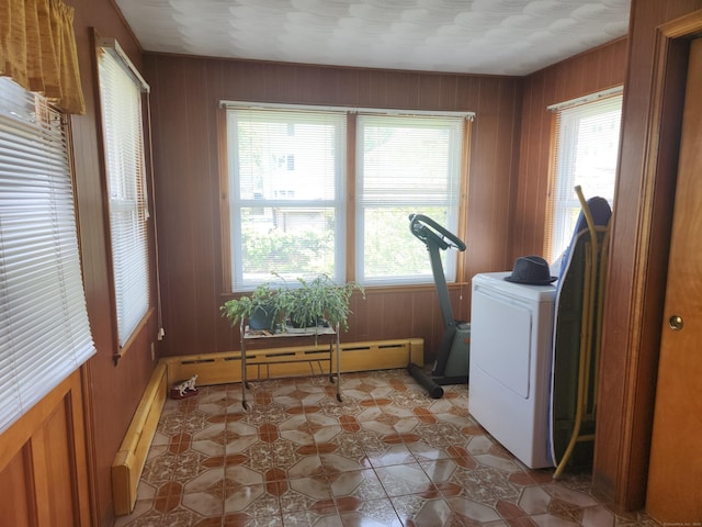 82 Hotchkiss St, Waterbury, CT 06704 - laundry room featuring wood walls, a baseboard radiator, light flooring, and washer / dryer