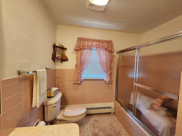 82 Hotchkiss St, Waterbury, CT 06704 - full bath featuring a baseboard radiator, tile walls, bath / shower combo with glass door, tile patterned floors, and wainscoting