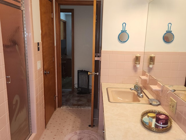 82 Hotchkiss St, Waterbury, CT 06704 - bathroom featuring tile walls, vanity, a stall shower, and a wainscoted wall