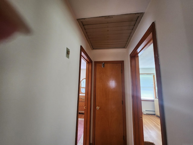 82 Hotchkiss St, Waterbury, CT 06704 - corridor featuring a baseboard radiator and light wood-type flooring