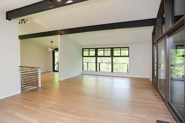 7 Hillcrest Ln, Weston, CT 06883 - unfurnished living room with light wood-style floors, healthy amount of natural light, and rail lighting