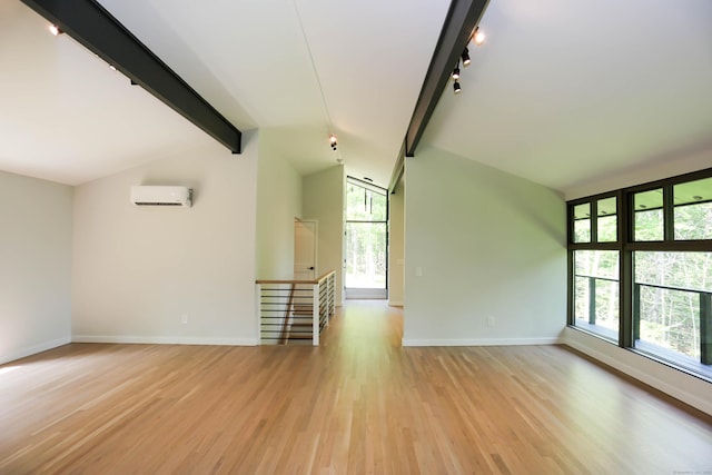 7 Hillcrest Ln, Weston, CT 06883 - unfurnished living room with a wall mounted air conditioner, plenty of natural light, light wood finished floors, and track lighting