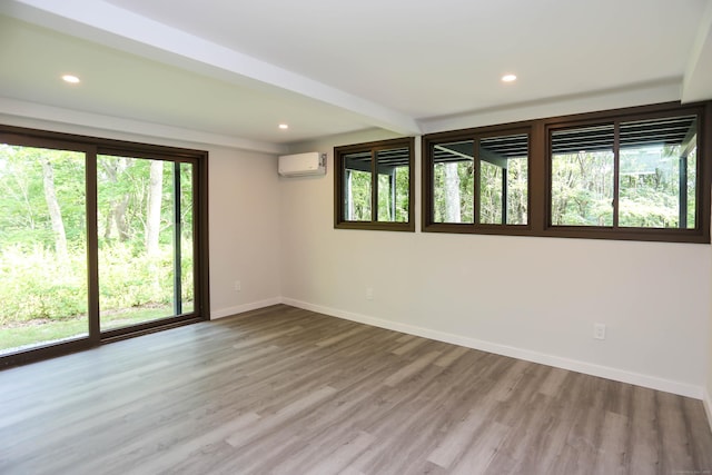 7 Hillcrest Ln, Weston, CT 06883 - spare room with wood finished floors, a wall mounted AC, and recessed lighting
