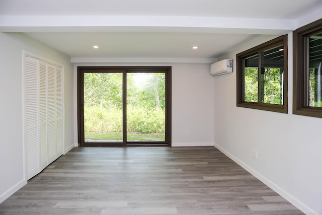 7 Hillcrest Ln, Weston, CT 06883 - spare room featuring an AC wall unit, recessed lighting, and wood finished floors