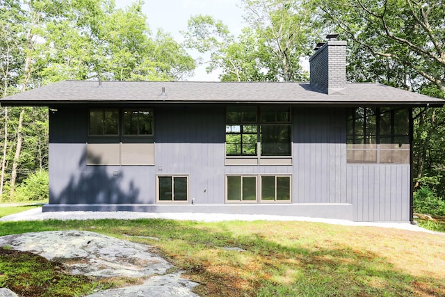 7 Hillcrest Ln, Weston, CT 06883 - rear view of house featuring a chimney, a lawn, and roof with shingles