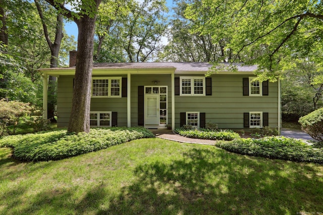 26 Wayfaring Rd, Norwalk, CT 06851 - raised ranch with a chimney and a front yard