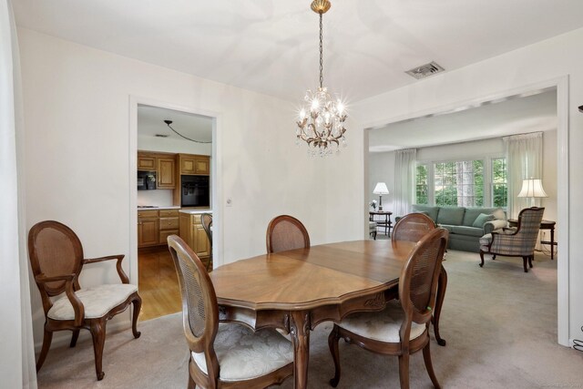 26 Wayfaring Rd, Norwalk, CT 06851 - dining space with a chandelier