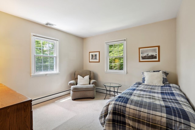 26 Wayfaring Rd, Norwalk, CT 06851 - carpeted bedroom featuring a baseboard heating unit and multiple windows