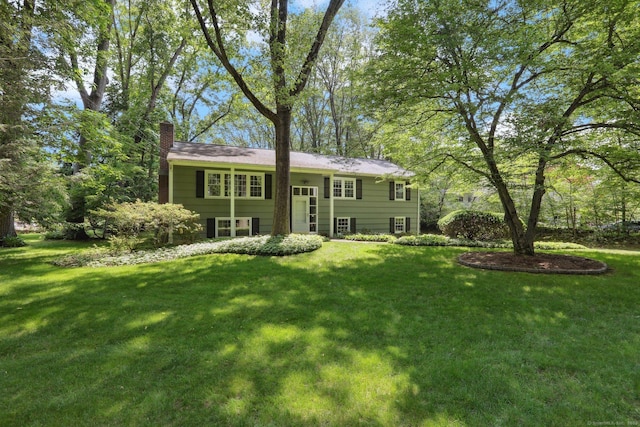 26 Wayfaring Rd, Norwalk, CT 06851 - back of house with a chimney and a lawn