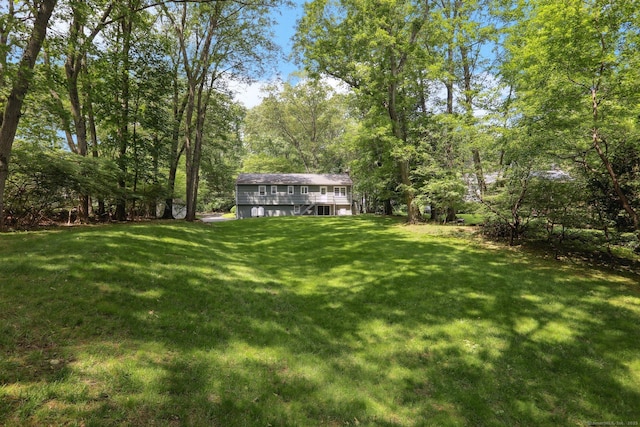 26 Wayfaring Rd, Norwalk, CT 06851 - view of green lawn with a wooden deck