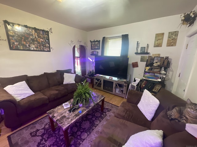 50 Beacon St, Waterbury, CT 06704 - living area featuring wood finished floors and arched walkways