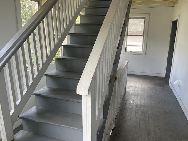 50 Beacon St, Waterbury, CT 06704 - stairway with baseboards and wood-type flooring