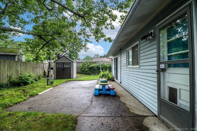 115 Sunburst Rd, Bridgeport, CT 06606 - fenced backyard featuring a storage unit and a patio