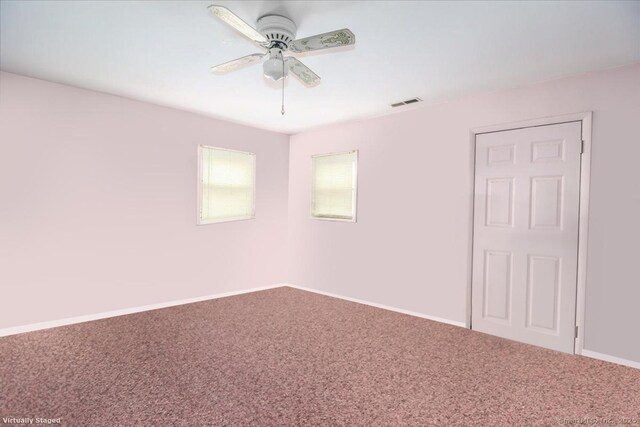 115 Sunburst Rd, Bridgeport, CT 06606 - empty room with a ceiling fan and carpet floors
