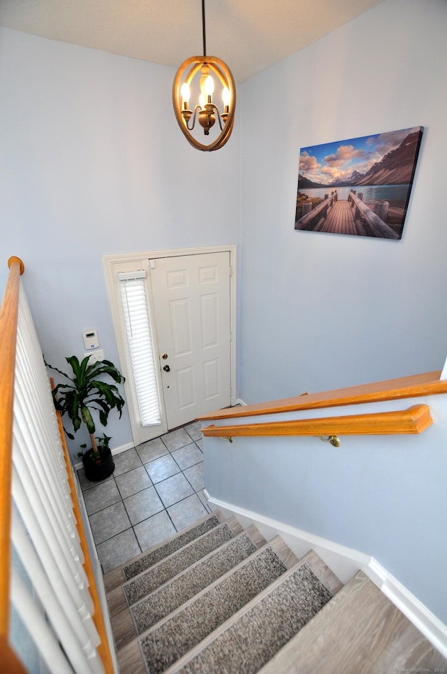 61 Windy Hill Ln Unit 61, Rocky Hill, CT 06067 - tiled foyer with a chandelier, stairs, and baseboards