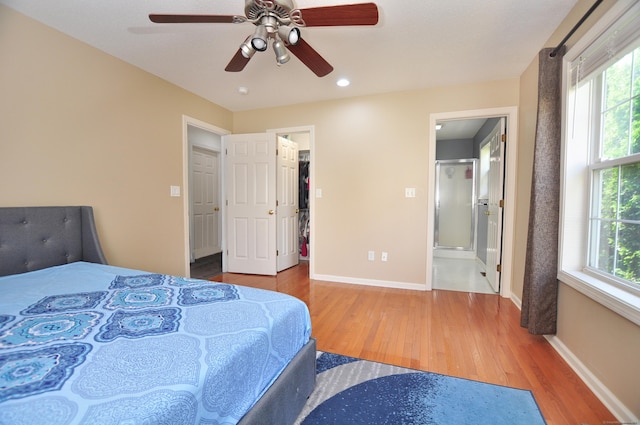 61 Windy Hill Ln Unit 61, Rocky Hill, CT 06067 - bedroom with wood finished floors, baseboards, multiple windows, a spacious closet, and recessed lighting
