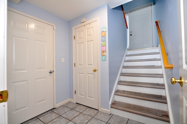 61 Windy Hill Ln Unit 61, Rocky Hill, CT 06067 - foyer entrance with light tile patterned floors, baseboards, and stairs