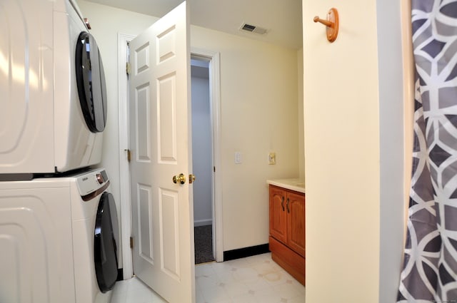 61 Windy Hill Ln Unit 61, Rocky Hill, CT 06067 - washroom with estacked washer and dryer and light floors