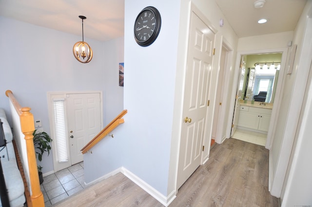 61 Windy Hill Ln Unit 61, Rocky Hill, CT 06067 - entrance foyer featuring light wood-style flooring, a chandelier, and baseboards
