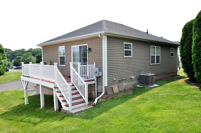61 Windy Hill Ln Unit 61, Rocky Hill, CT 06067 - back of house featuring central AC unit, a lawn, and a wooden deck
