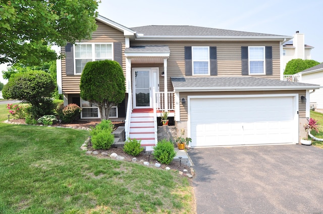 61 Windy Hill Ln Unit 61, Rocky Hill, CT 06067 - split foyer home featuring asphalt driveway, an attached garage, a front yard, and roof with shingles