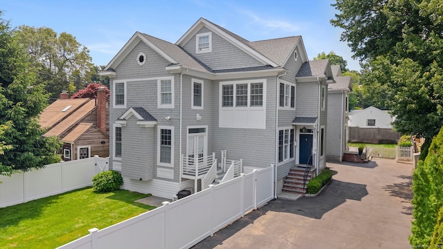 868 S Pine Creek Rd, Fairfield, CT 06824 - view of front of home with a patio and a shingled roof