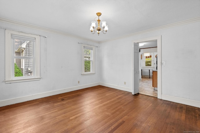 28 Wardwell Rd, West Hartford, CT 06107 - spare room with wood-type flooring, a chandelier, crown molding, and baseboards