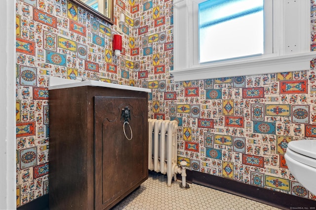28 Wardwell Rd, West Hartford, CT 06107 - half bathroom featuring toilet, radiator heating unit, and wallpapered walls
