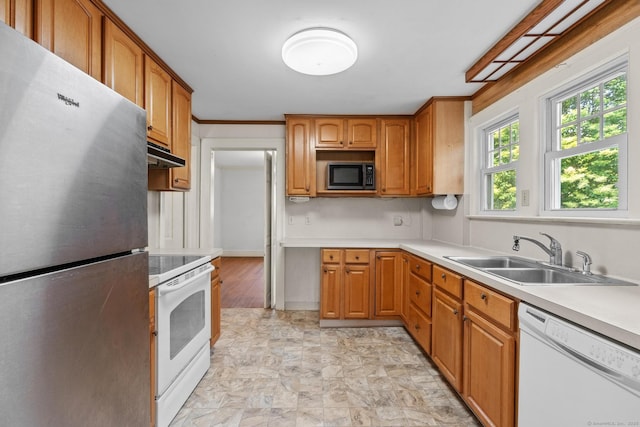 28 Wardwell Rd, West Hartford, CT 06107 - kitchen with white appliances, a sink, under cabinet range hood, light countertops, and brown cabinets