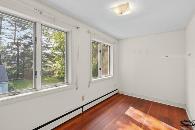28 Wardwell Rd, West Hartford, CT 06107 - spare room with a baseboard heating unit, dark wood-type flooring, and baseboards