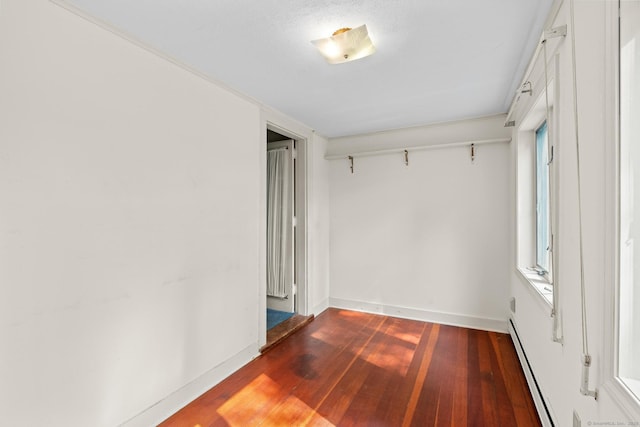 28 Wardwell Rd, West Hartford, CT 06107 - unfurnished room featuring wood finished floors, baseboards, and a baseboard radiator