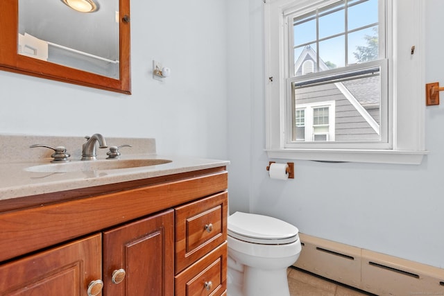 28 Wardwell Rd, West Hartford, CT 06107 - bathroom with vanity, toilet, baseboard heating, and tile patterned floors