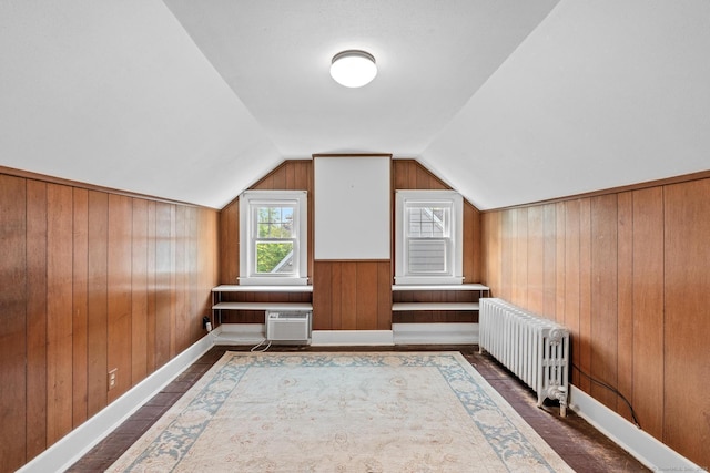 28 Wardwell Rd, West Hartford, CT 06107 - additional living space with radiator heating unit, wooden walls, vaulted ceiling, a wall mounted AC, and baseboards
