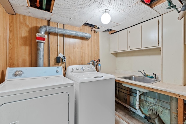 28 Wardwell Rd, West Hartford, CT 06107 - laundry room with washer and dryer, wood walls, and cabinet space