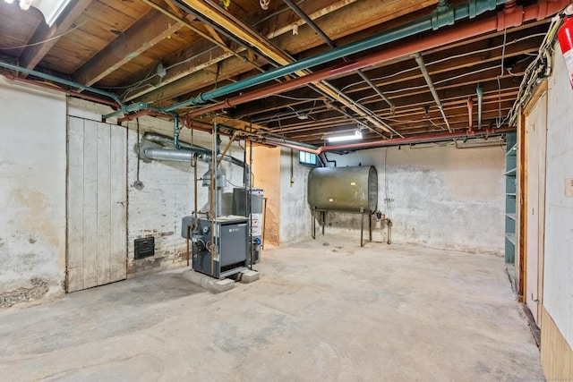 28 Wardwell Rd, West Hartford, CT 06107 - unfinished below grade area with heating fuel, water heater, and a heating unit